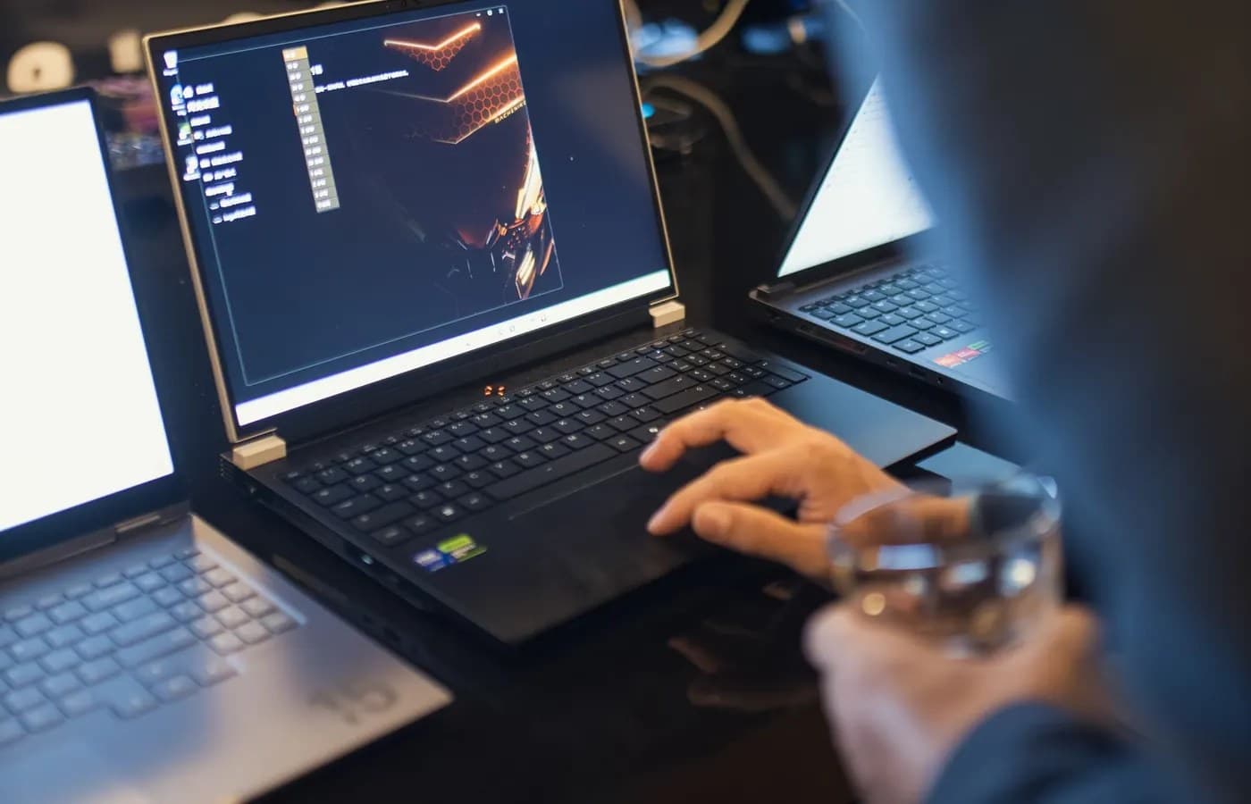 IT professional troubleshooting software on a laptop