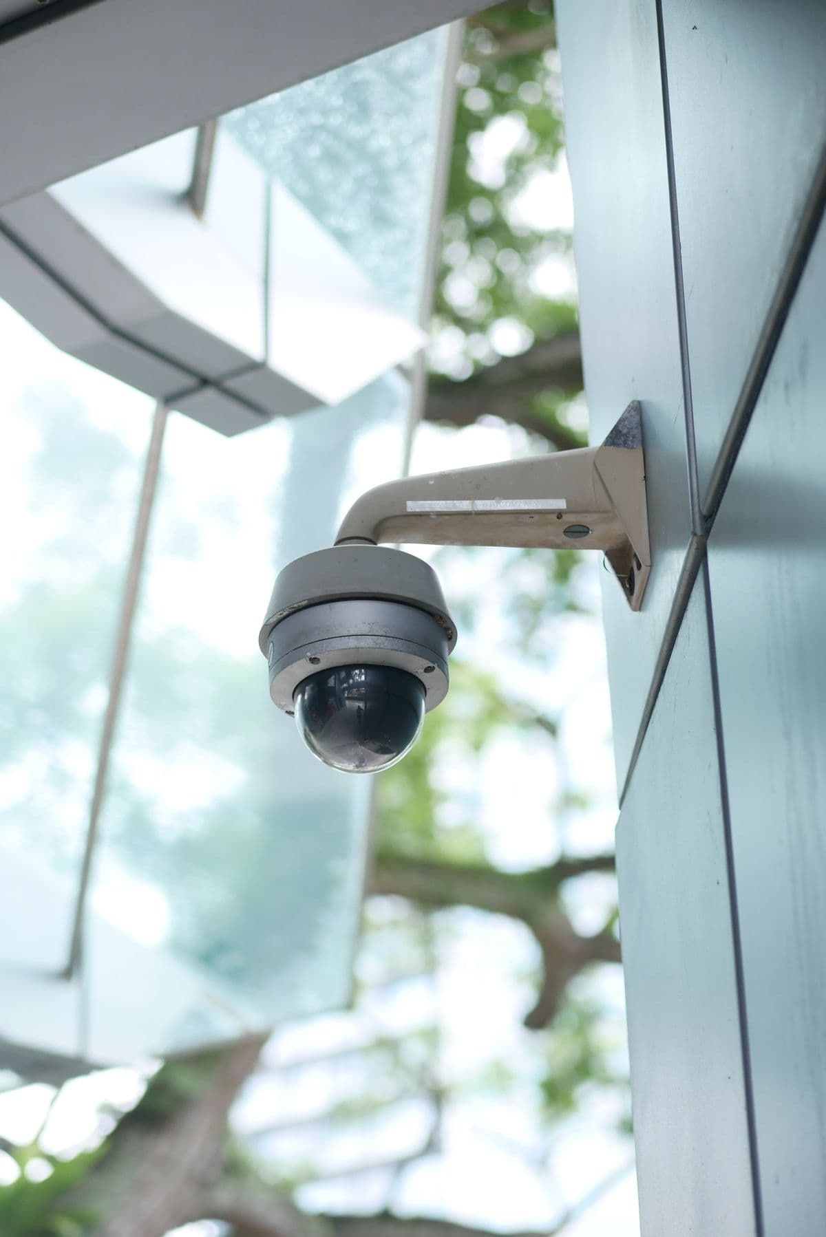 Outdoor surveillance camera mounted on a building wall