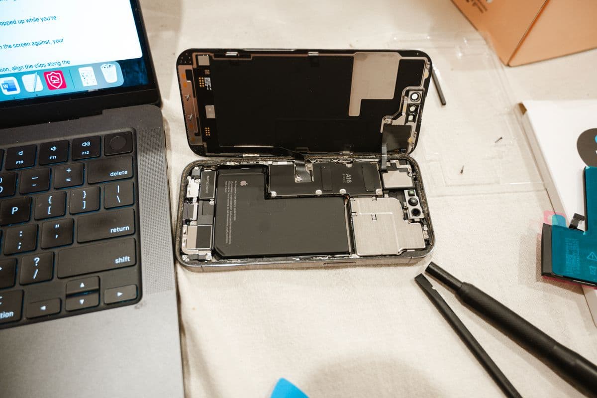iPhone opened for battery and screen repair with tools